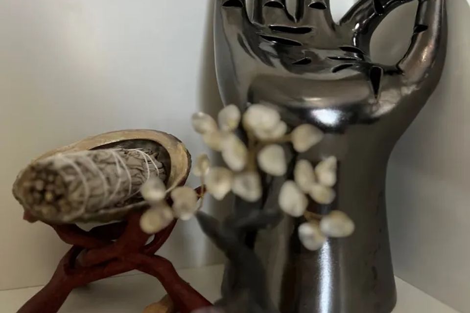 A close view of a metal singing bowl and mallet