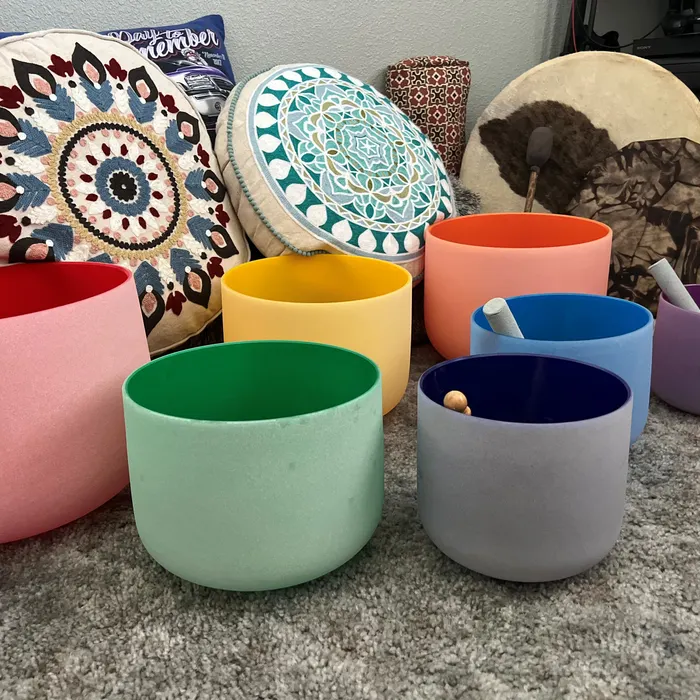 Crystal singing bowls arranged for a sound bath session